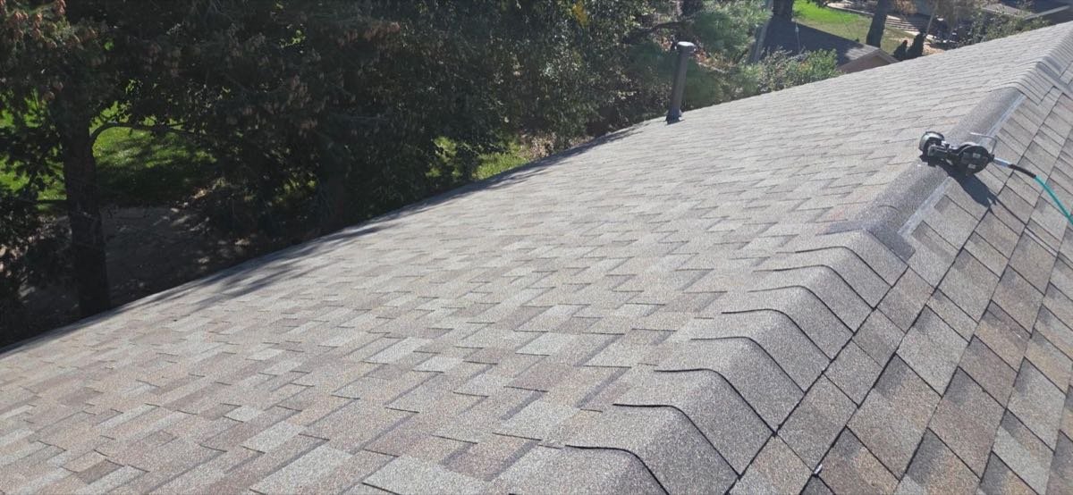 Close view of finished ridge cap shingles on a residential roof